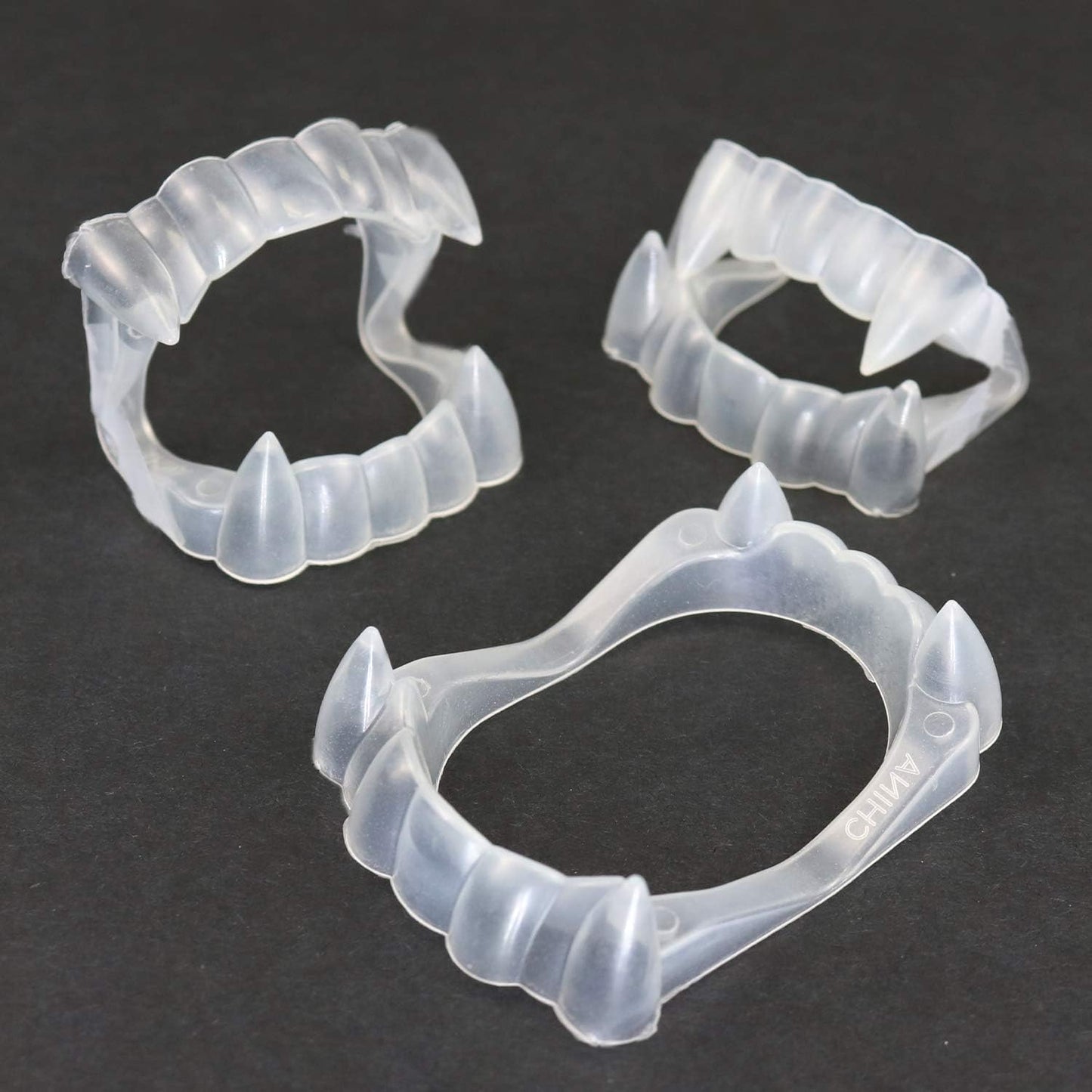 GIFTEXPRESS Colmillos que brillan en la oscuridad, dientes de vampiro/colmillos de Drácula, paquete individual, paquete de 144